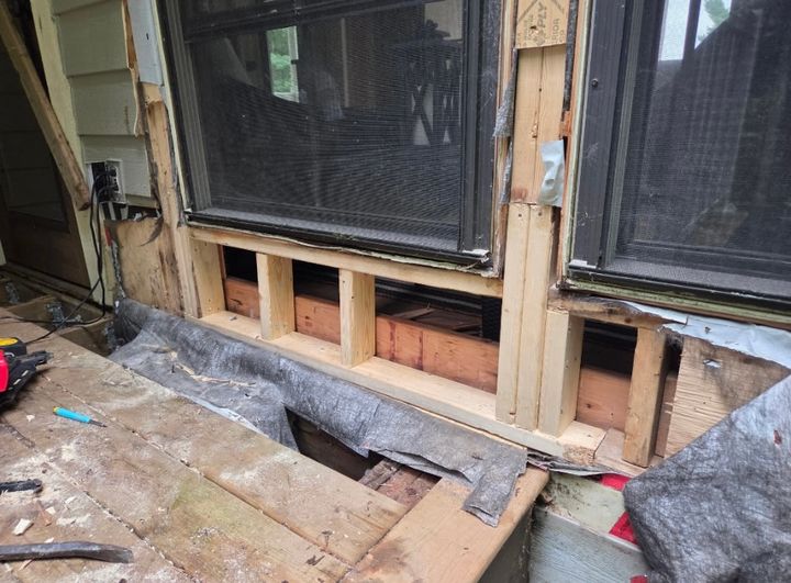 New lumber framed in under the same two windows after the rotted sill and studs were cut out and replaced